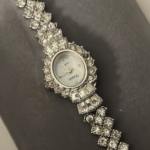 Chrystal and stainless watch that is working